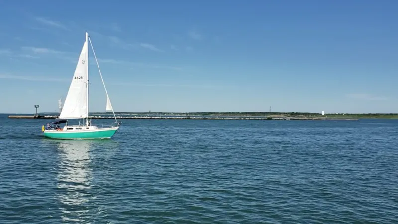 headlands beach sail boat